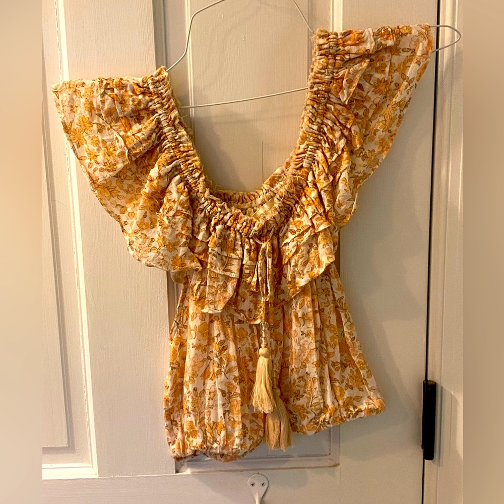 Dainty LoveShackFancy Off the Shoulder Blouse in shades of peachy yellow.